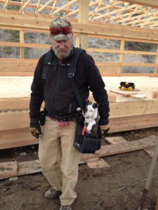 dog and man rebuild barn